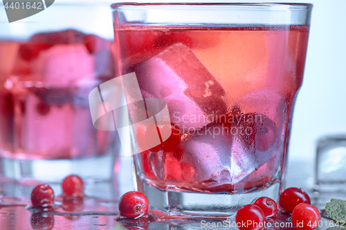 Image of closeup of a cape cod cocktail or vodka cranberry on a blue background