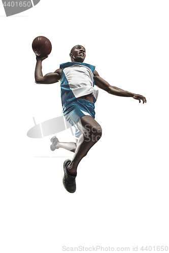 Image of Full length portrait of a basketball player with ball