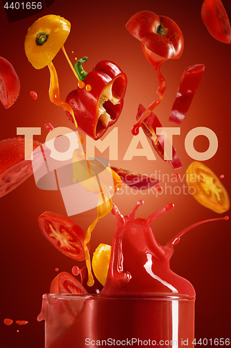 Image of Red tomato with pait splash on red background