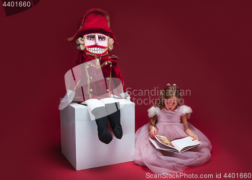 Image of The beauty ballerina sitting with nutcracker