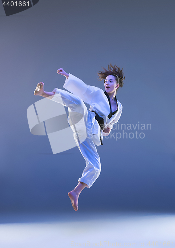 Image of The karate girl with black belt