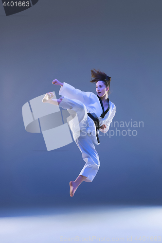 Image of The karate girl with black belt