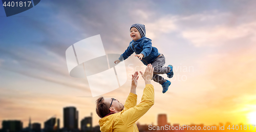 Image of father with son playing and having fun outdoors