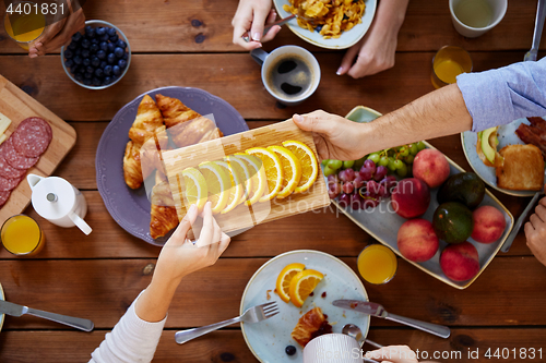 Image of group of people having breakfast at table