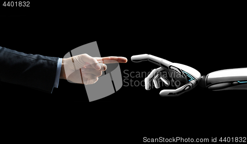 Image of robot and human hand connecting fingers