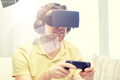 Image of man in virtual reality headset with controller