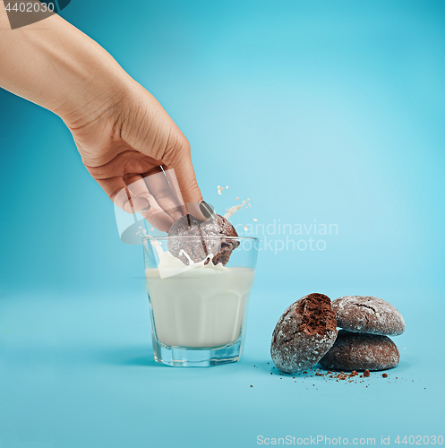 Image of Glass of milk and oatmeal cookies. Morning dessert