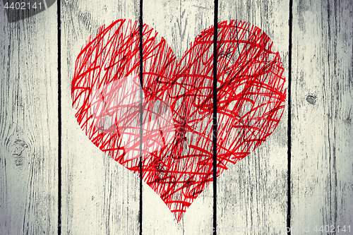 Image of Abstract heart with messy pattern on vintage wooden wall