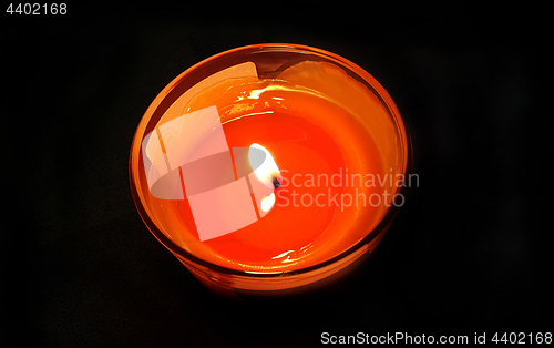 Image of Burning candle in the dark