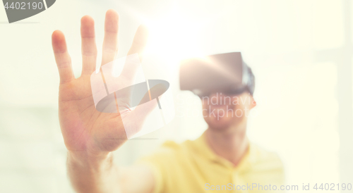 Image of young man in virtual reality headset or 3d glasses