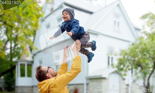 Image of father with son playing and having fun outdoors