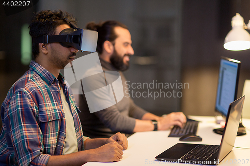 Image of creative man in virtual reality headset at office