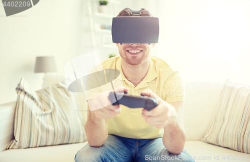 Image of man in virtual reality headset with controller