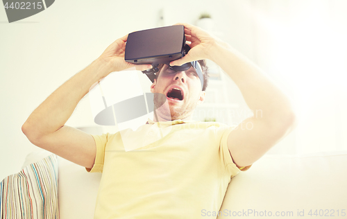 Image of young man in virtual reality headset or 3d glasses