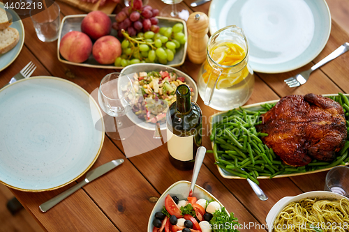 Image of various food on served wooden table