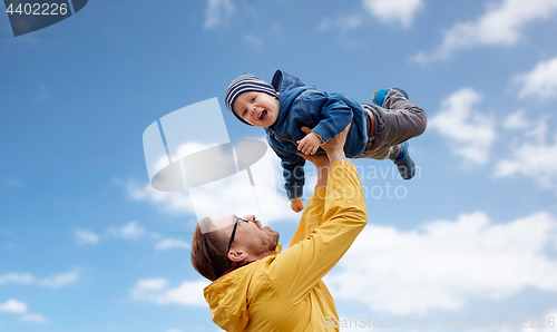 Image of father with son playing and having fun outdoors