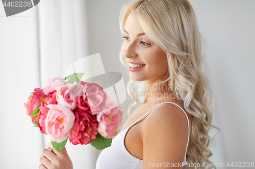 Image of close up of woman with bunch of flowers