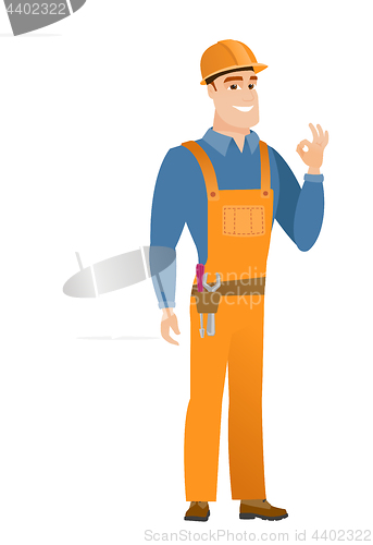 Image of Smiling builder showing ok sign.