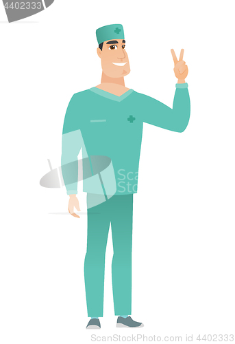 Image of Caucasian doctor showing the victory gesture.