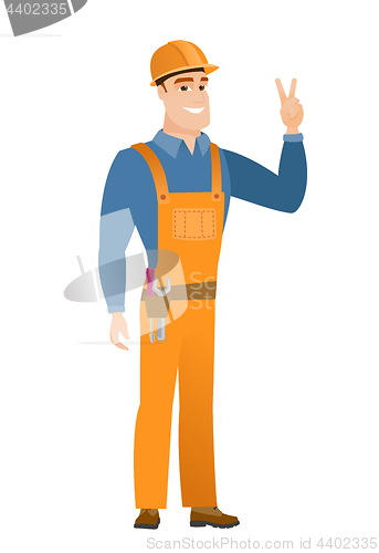 Image of Caucasian builder showing the victory gesture.
