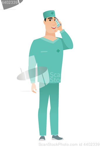 Image of Doctor talking on a mobile phone.