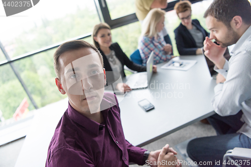 Image of Group of young people meeting in startup office