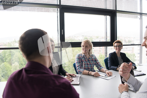 Image of Group of young people meeting in startup office