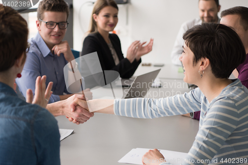 Image of Business Team At A Meeting at modern office building