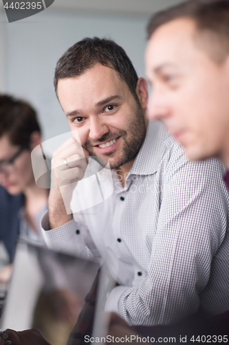 Image of Business Team At A Meeting at modern office building
