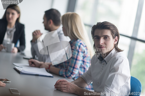 Image of Group of young people meeting in startup office