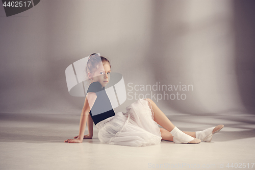 Image of The little balerina dancer on gray background