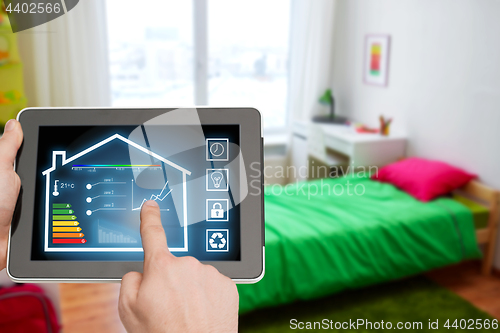 Image of tablet pc with smart home settings on screen