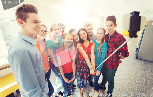 Image of group of students taking selfie with smartphone