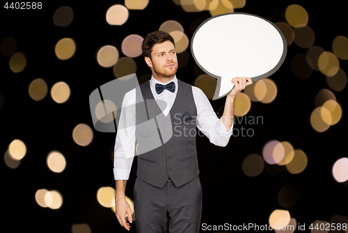 Image of man in suit holding blank text bubble banner