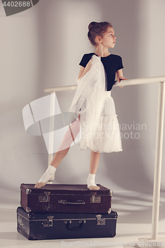 Image of The little girl as balerina dancer standing at studio