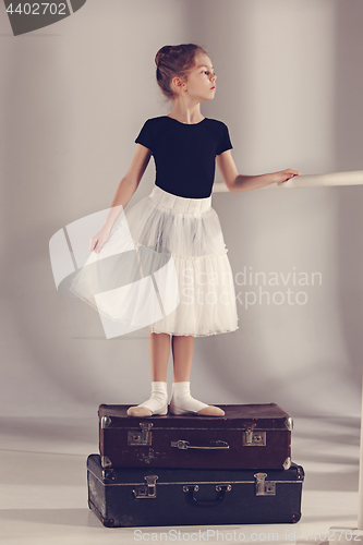 Image of The little girl as balerina dancer standing at studio