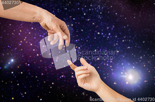 Image of close up of senior and young woman hands in space