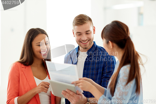 Image of creative team talking at office coffee break