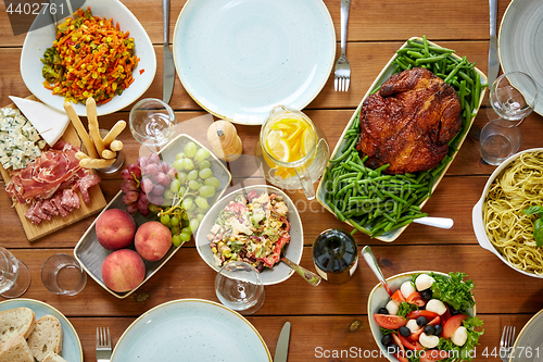 Image of various food on served wooden table