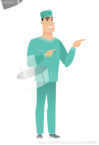 Image of Young caucasian doctor pointing to the side.