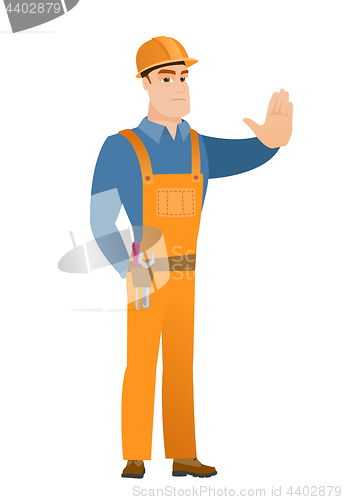 Image of Caucasian builder showing stop hand gesture.