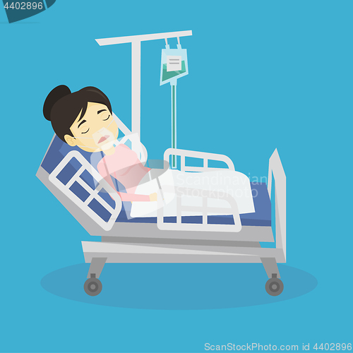 Image of Patient lying in hospital bed with oxygen mask.
