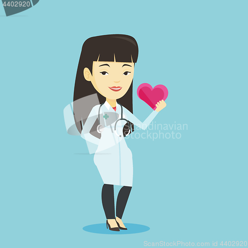 Image of Doctor cardiologist holding heart.