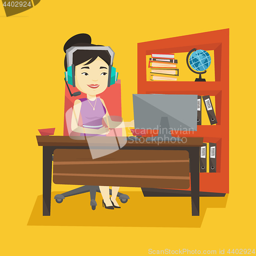 Image of Business woman with headset working at office.