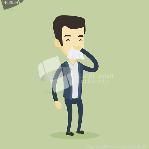 Image of Young asian sick man sneezing.