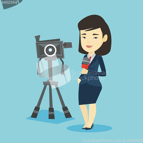 Image of TV reporter with microphone and camera.