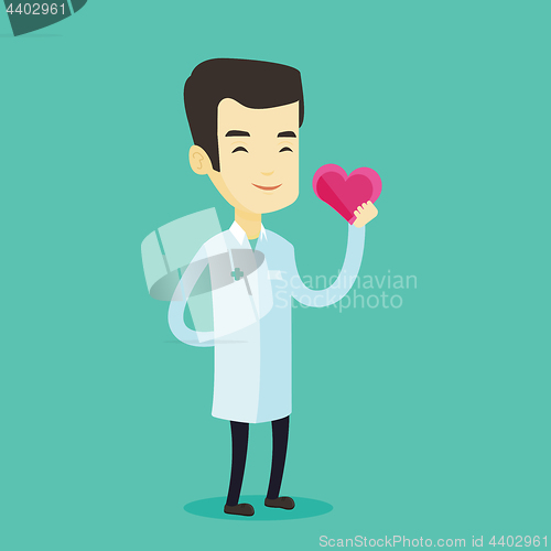 Image of Doctor cardiologist holding heart.