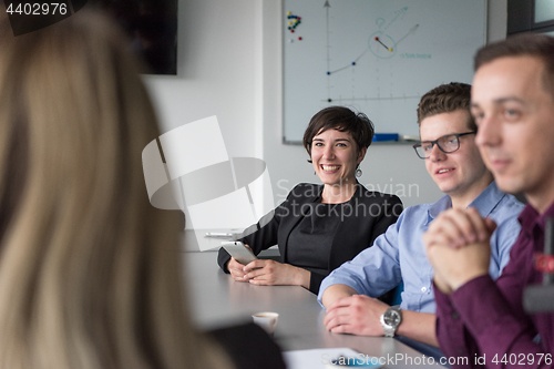 Image of Group of young people meeting in startup office