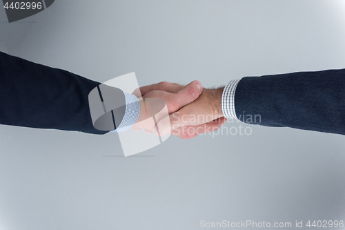 Image of cloasing the deal in modern office interior top view