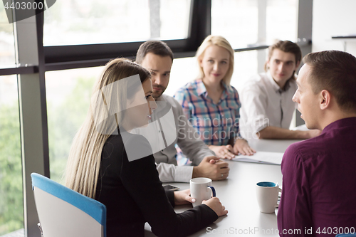 Image of Group of young people meeting in startup office